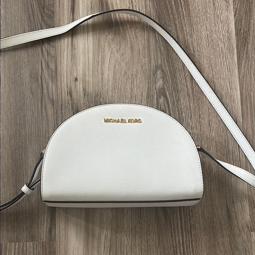 white micheal kohrs crossbody with gold accents